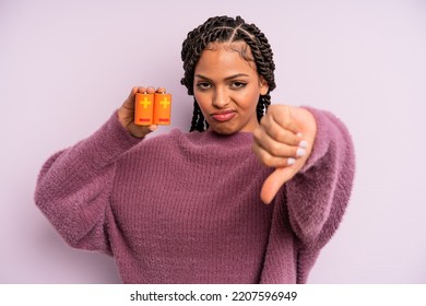 Black Afro Hairstyle Woman Feeling Cross,showing Thumbs Down. Battery Concept