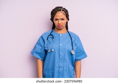 Black Afro Hairstyle Woman Feeling Sad And Whiney With An Unhappy Look And Crying. Nurse Concept