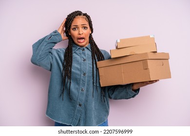 Black Afro Hairstyle Woman Screaming With Hands Up In The Air. Packages Box Concept