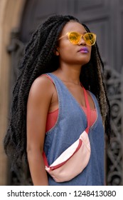 Black Afro Punk Girl Magic Fashion Shoot In A Dark Gateway Illuminated By Warm Natural Light. Powerful Ethnic Beauty And Style  