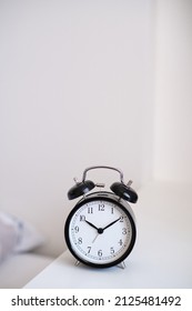 Black Alarm Clock On Night Stand, Ten Past Ten Oclock