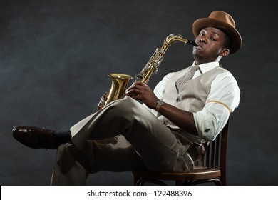 Black American Jazz Saxophone Player. Vintage. Studio Shot.