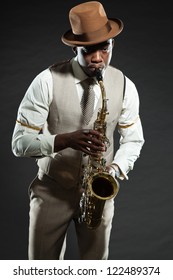 Black American Jazz Saxophone Player. Vintage. Studio Shot.