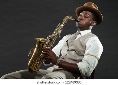 Black American Jazz Saxophone Player. Vintage. Studio Shot.