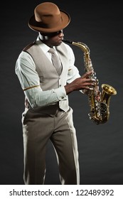 Black American Jazz Saxophone Player. Vintage. Studio Shot.