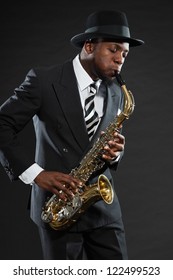 Black American Jazz Saxophone Player. Vintage. Studio Shot.