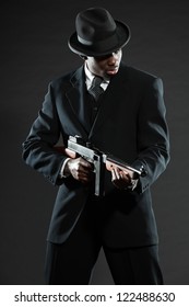 Black American Mafia Gangster Man In Suit With Gun.