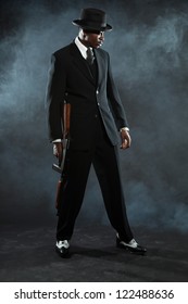 Black American Mafia Gangster Man In Suit With Gun.