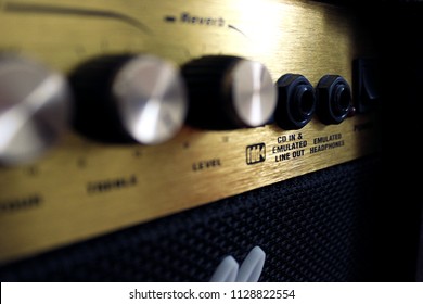 Black Amplifier (amp) With Golden Dashboard.