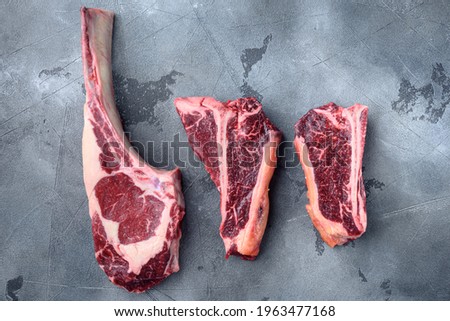 Similar – Dry aged raw tomahawk beef steak isolated on white background