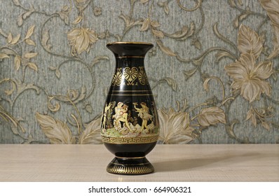 Black antique vase with gold pattern in the interior