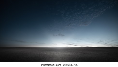Black Asphalt Floor Background with Dark Blue Night Sky Sunset Horizon and Subtle Clouds