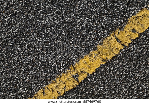 Black asphalt road with yellow dividing line.
Transportation background
texture