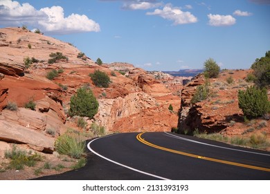 The Black Asphalt Switchbacks Surrounded By Red Rock Walls Crossing The Capitol Reef National Park In Utah