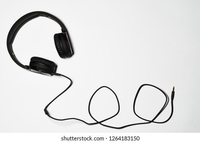Black audio headphones isolated on white background