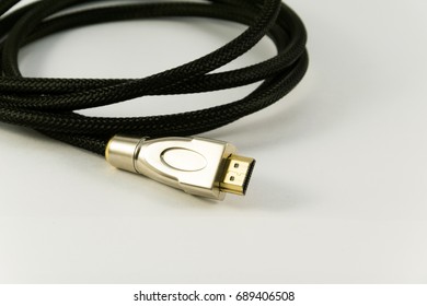 Black audio video HDMI computer cable isolated on white background.