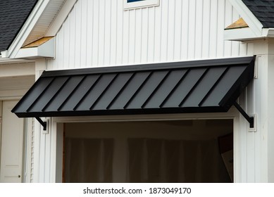 black awning door steel front wall shadow