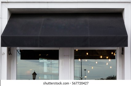 black awning over cafe windows