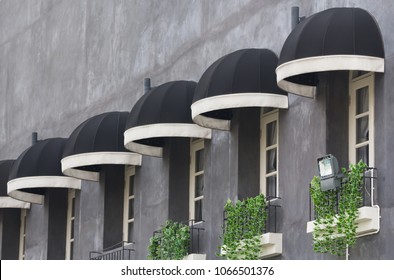 Black Awning Over Windows At House Canopy.