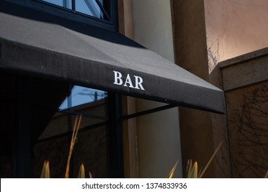 A Black Awning With The Word Bar On The Front