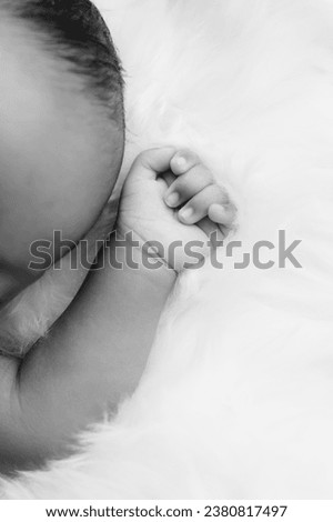 Newborn lying on the bed with her mother