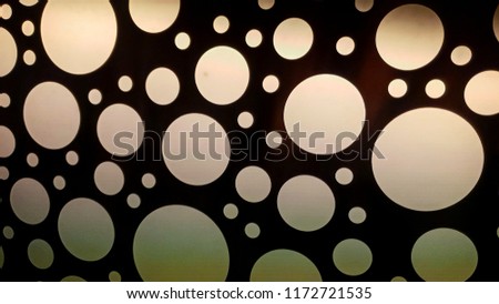 black background with large and small cirlcles lighting