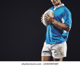 Black background, man and ball for rugby sport, closeup and mockup space, sportswear and professional for workout. Male person or player, fitness and athlete for football game or match and strong - Powered by Shutterstock