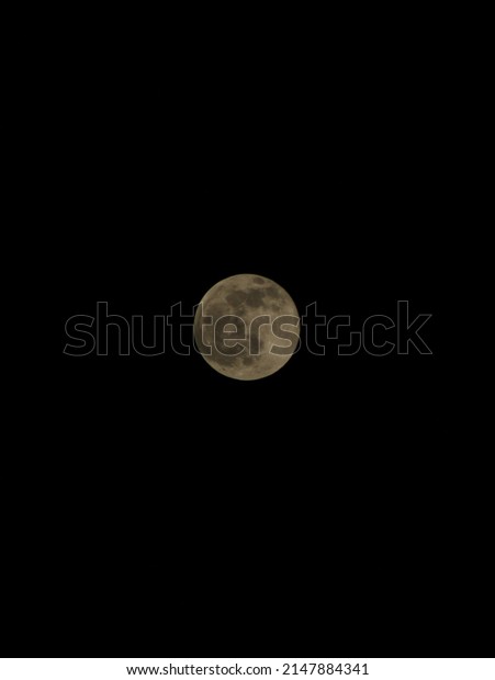 Black
background and in the middle there is a full
moon
