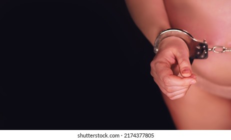 Black Background And Pregnant Woman In Metal Hand Cuffs, Copy Space With A Place Under The Text On The Prohibition Of Abortions