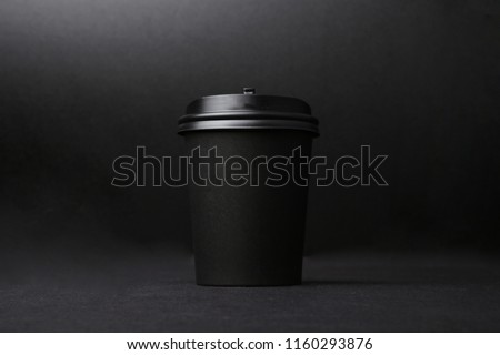Black background takeaway coffee cup