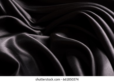 Black Background Texture - Dark Wavy Glossy Silk Drapery.