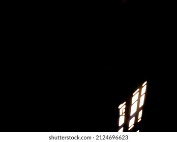 Black background wall and light passing through window 