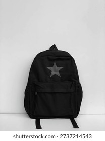 Black backpack with star design front view