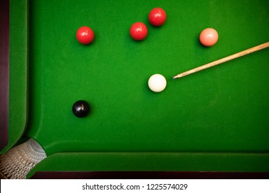 black ball shot in snooker game. top view