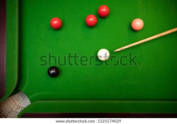 black ball shot in\
snooker game. top view