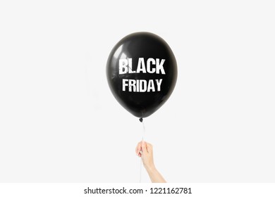 Black balloon in girl's hand. Black Friday