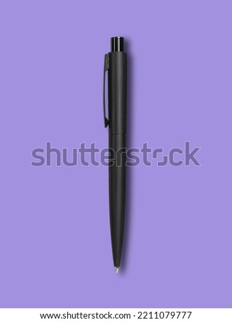 black ballpoint pen purple background black ballpoint pen with shadow copy space for your text