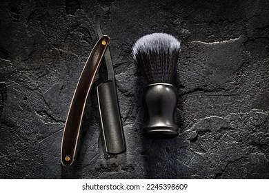 Black Barber Tools. Shaving Brush And Opened Straight Razor With Classic Wooden Handle On Abstract Dark Background - Shutterstock ID 2245398609