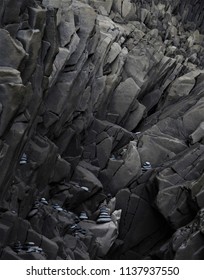 Black Basalt Glass Structures With Little Stone Figures In Between In Iceland