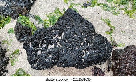 Black Basalt Rocks On The Beach. Jeju, South Korea