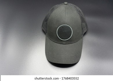 Black Baseball Cap With Round Space For Logo. Top Front View, Isolated On Gray Background