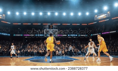 Black Basketball Player Running to Score an Impressive Two-Point Goal with a Slam Dunk in Front of Cheering Audience of Fans. Cinematic Sports TV Channel Shot with Back View Action.
