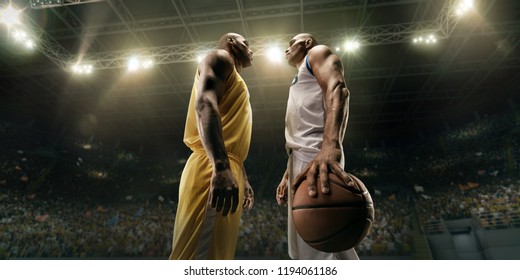 Black basketball players on big professional arena before the game. Two teams. Players collided face to face. Player holds a ball - Shutterstock ID 1194061186