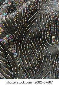 Black Beaded and Sequin Fabric Textile Close Up Macro Shiny Glam Glitzy Formal Dressy Folds Background Wallpaper Pattern Texture Stripes Lines Curves Metallic Iridescent Dress