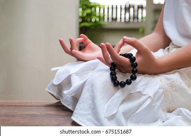 Black beads bracelet in girl hand. Can be used as fashion accessories, also as praying beads, for counting prayers or practicing mindfulness meditation. Some believe black stone has protection power. - Powered by Shutterstock