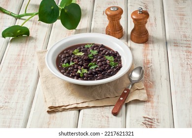 Black Bean Soup In A Bowl On A Rustic Table.