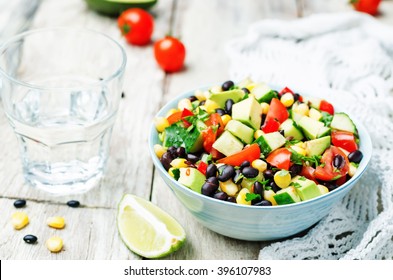 Black Beans Corn Avocado Cucumber Tomato Salad With Lime Dressing. Toning. Selective Focus