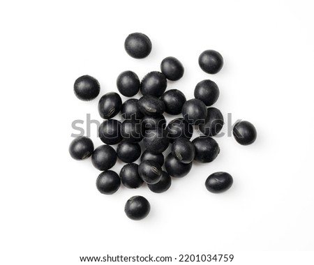 Black beans placed on a white background. Black soybeans (kurodazu). View from directly above.
