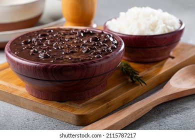 Black Beans And Rice In Wooden Bowl.