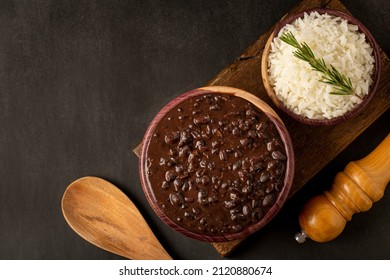 Black Beans And Rice In Wooden Bowl.